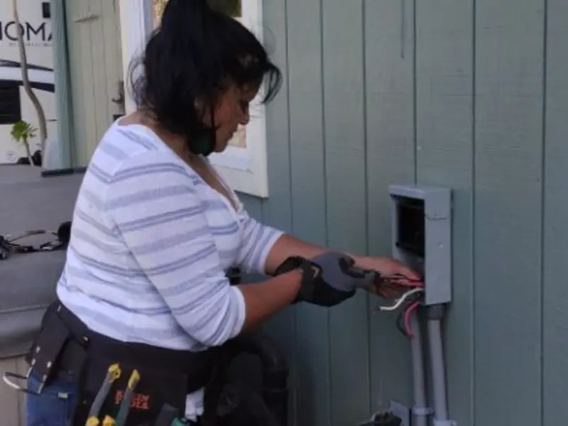 Licensed electrician wiring an exterior subpanel in Shackle Island