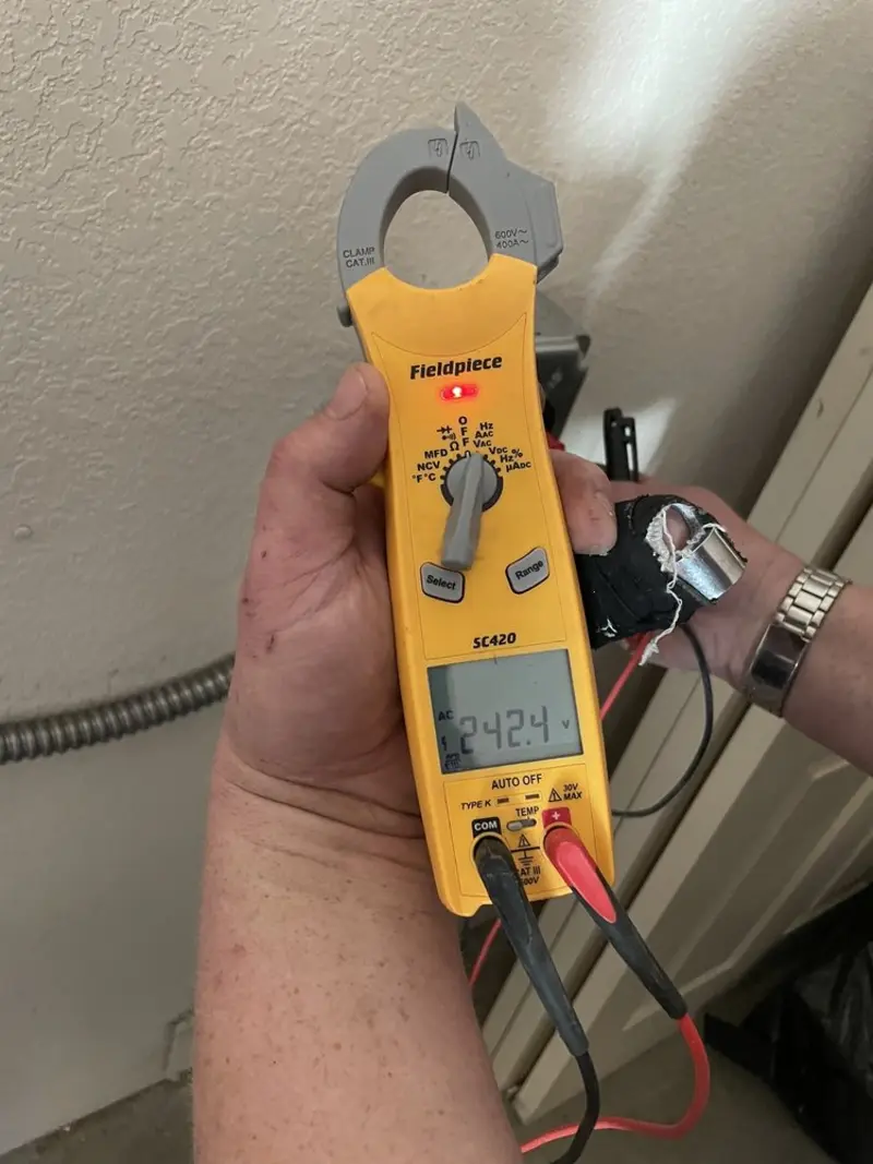 Voltage testing with clamp meter during Electrical Installation Services in Shackle Island